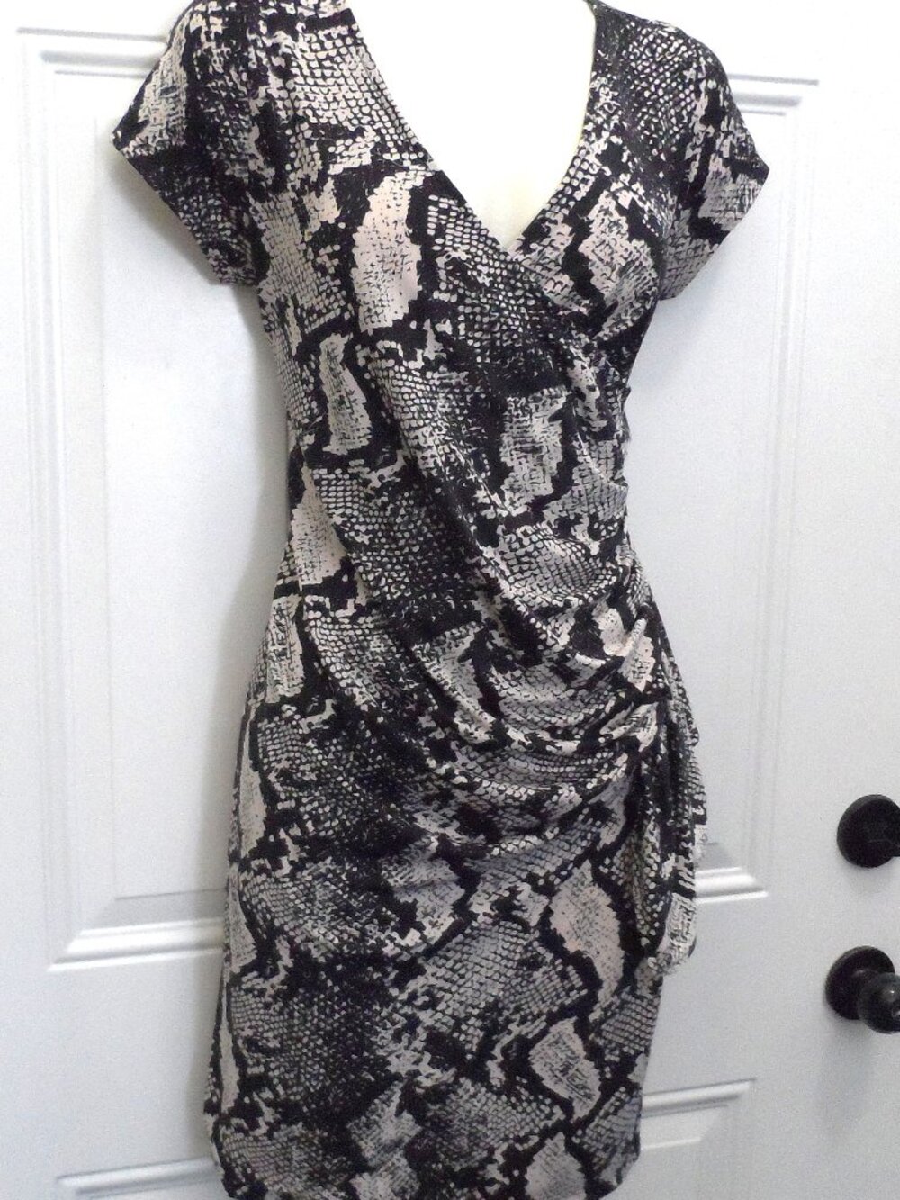 short-sleeved dress black/ white snake print pattern with a draped front -sz M